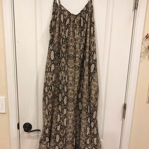 Snakeskin romper size 1x (will fit a large).  Polyester with pockets.